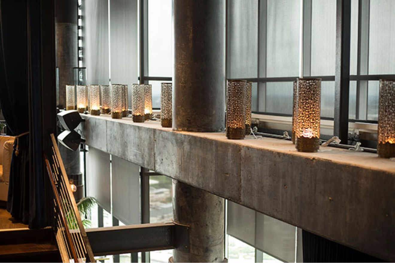 Tall commercial windows with solar shades in a hospitality space