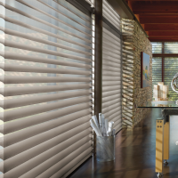 Commercial window shades in a modern Pittsburgh office with custom solar roller shades for glare and light control